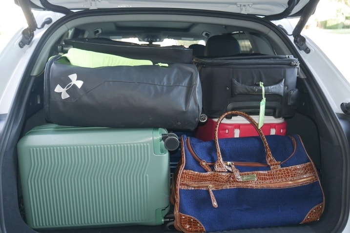 Five suitcases, two duffel bags and a cooler in an Audi Q6 E-Tron