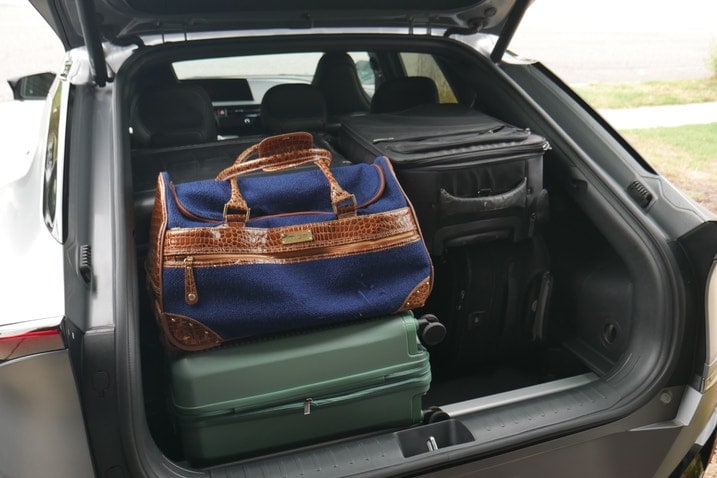 Six suitcases in the Kia EV6 cargo area