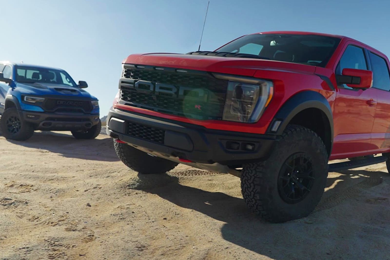 2023 Ford F-150 Raptor R vs. Ram 1500 TRX front