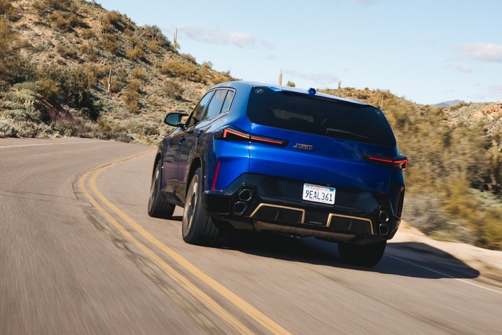 2023 BMW XM driving, rear view