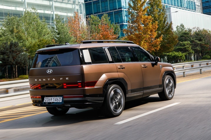 2024 Hyundai Santa Fe driving, rear three-quarter