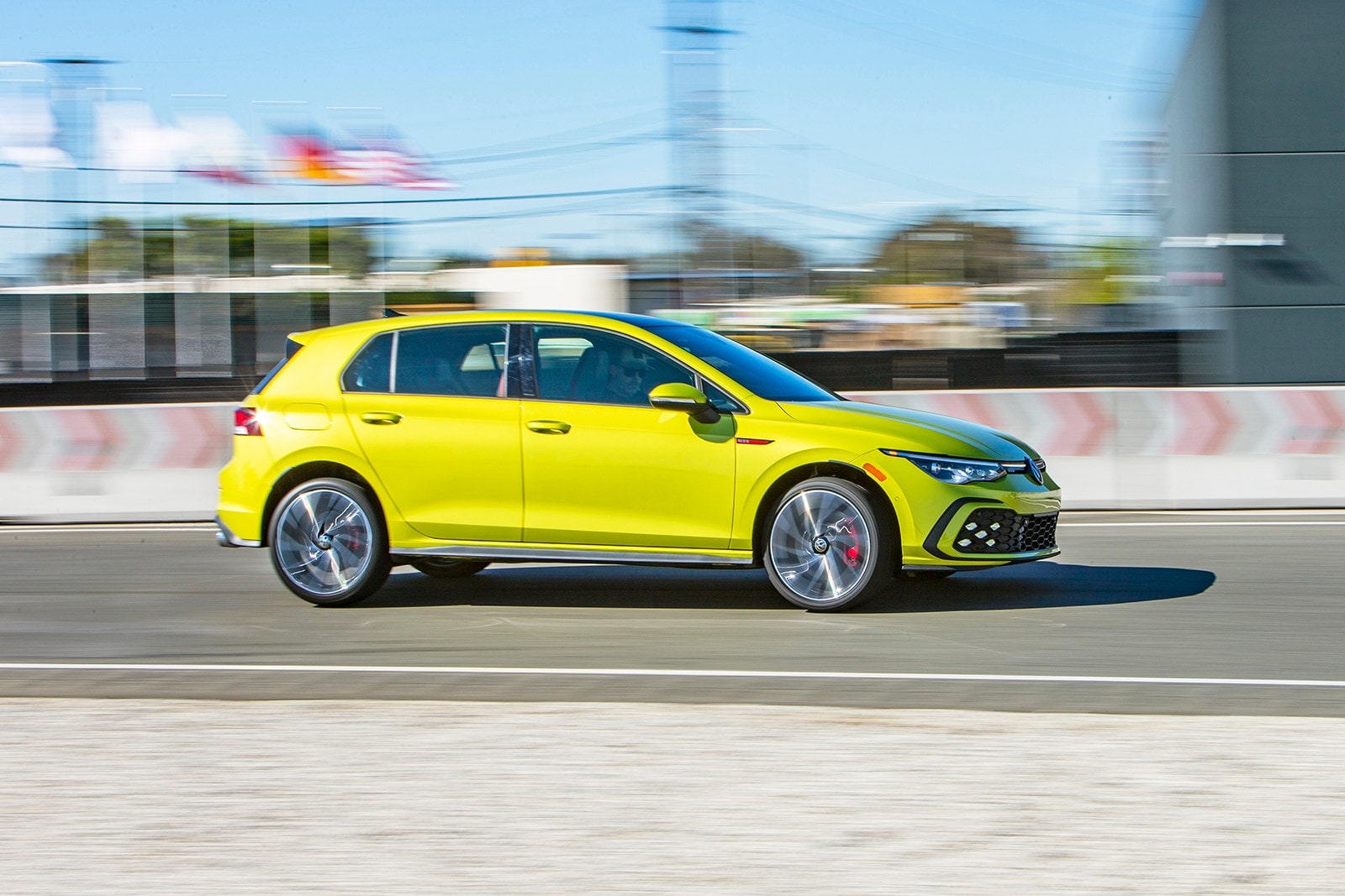 2022 Volkswagen Golf GTI profile view on a racetrack