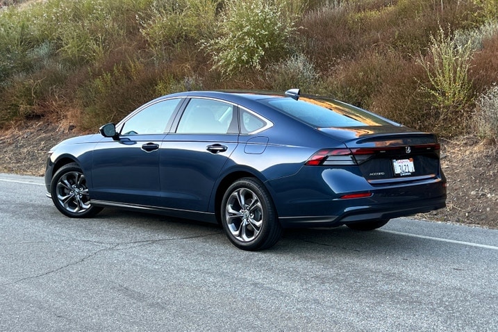 2023 Honda Accord EX in Canyon River Blue parked on a road at sunset