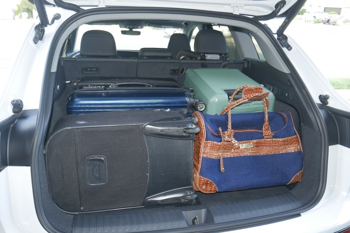 Audi Q6 E-Tron cargo area with five suitcases and duffel bag