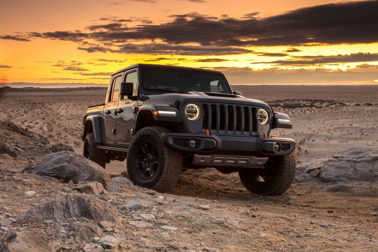 2023 Jeep Gladiator Mojave parked in the desert at sunset.
