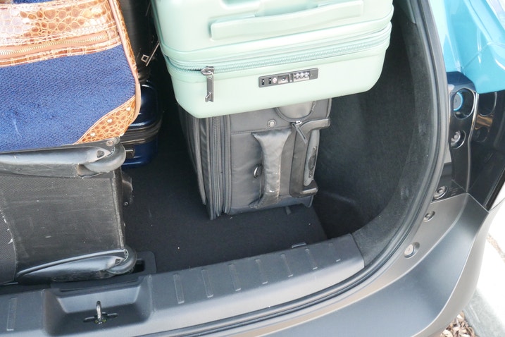 Space remaining in Nissan Kicks cargo area after six suitcases were loaded