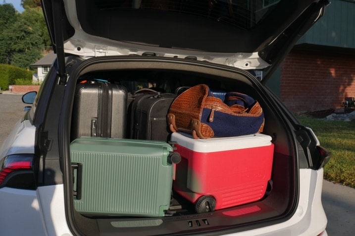 Six suitcases and a cooler in the back of the Lincoln Nautilus