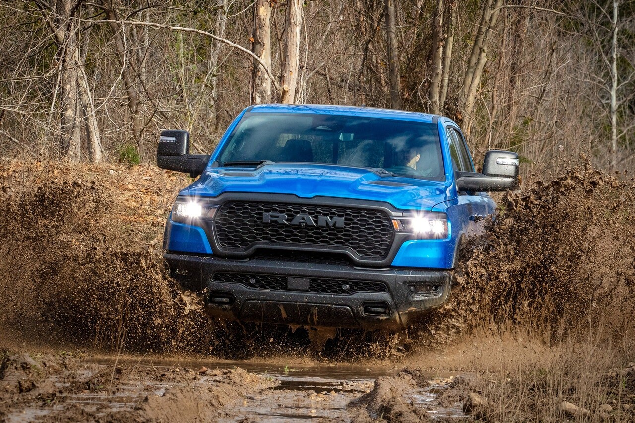 2025 Ram 1500 Rebel driving in mud