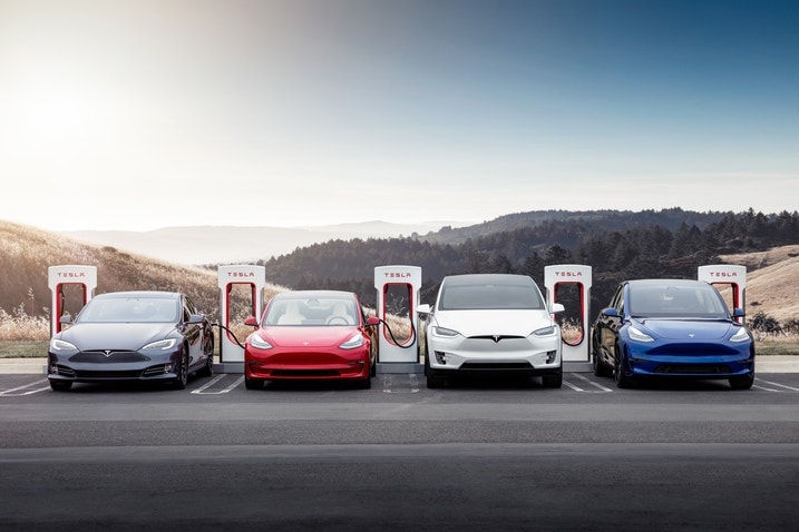 Teslas parked at Superchargers