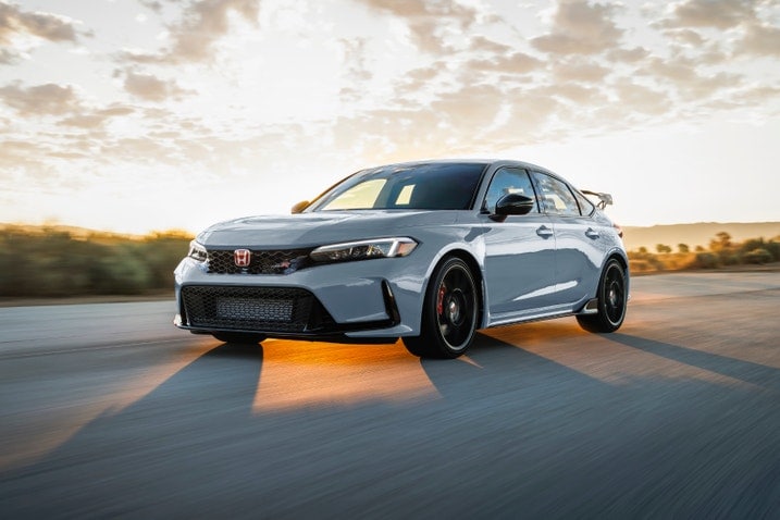 2023 Honda Civic Type R in Sonic Gray Pearl, driving on a road