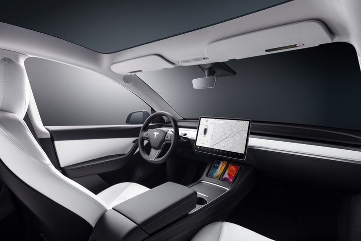 2023 Tesla Model Y interior showing the dashboard and front seats