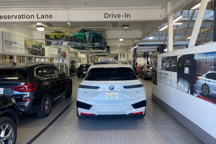 BMW iX at dealership service bay