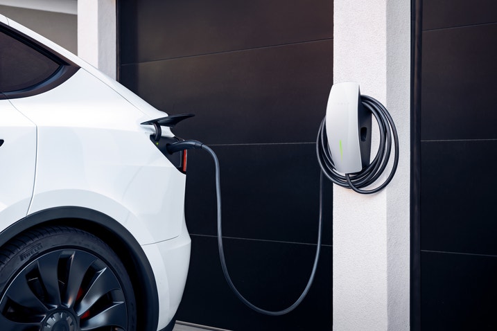 A Tesla charging at home