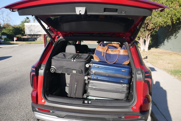 Chevrolet Traverse cargo area with seven suitcases