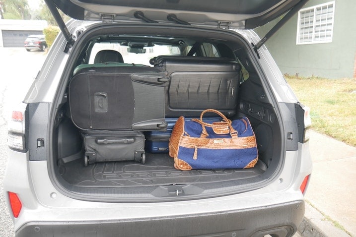 Six suitcases in Subaru Forester cargo area