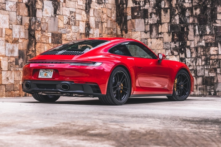 Carmine Red Porsche 911 GTS rear three-quarter