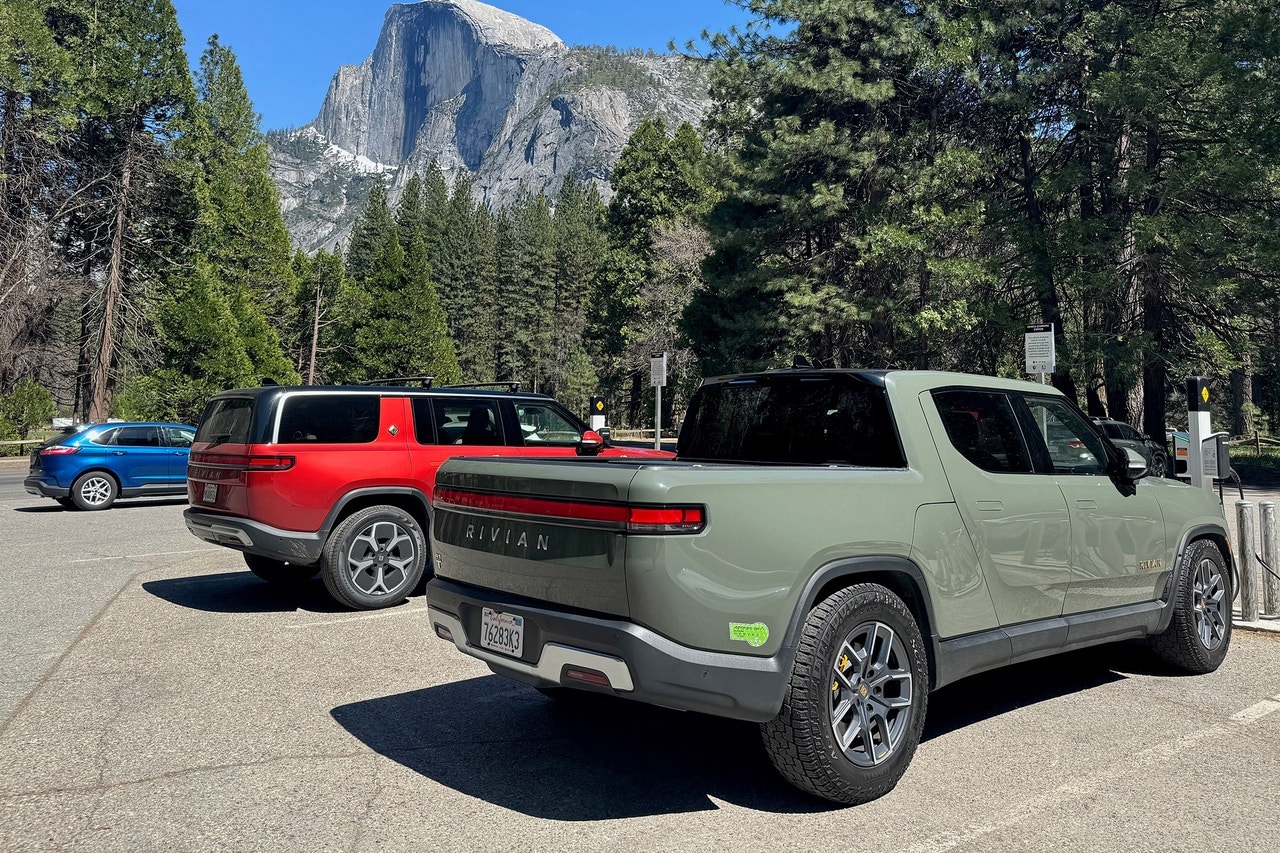 Rivian R1T and R1S at a charging station