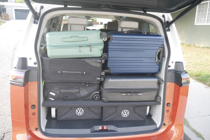 Five suitcases behind third row with third row slid forward and platform in place