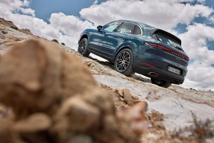 2024 Porsche Cayenne scaling a hill