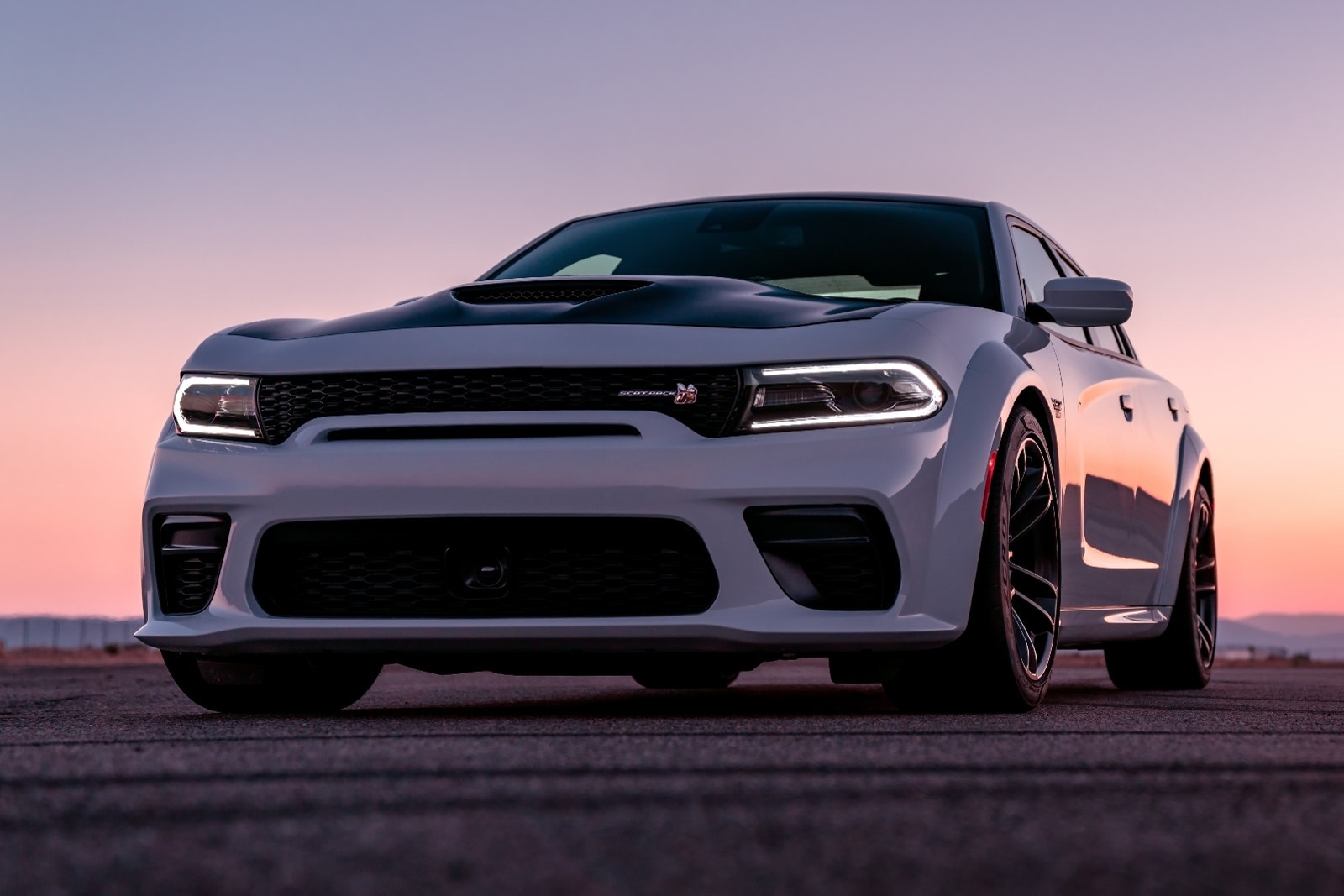 2023 Dodge Charger 392 Scat Pack in white, parked during sunset.