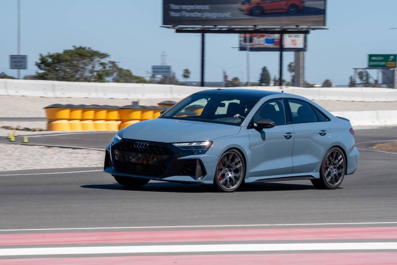 2025 Audi RS 3 driving at a test track.