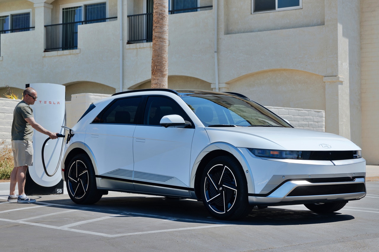 2025 Hyundai Ioniq 5 at a Tesla Supercharger