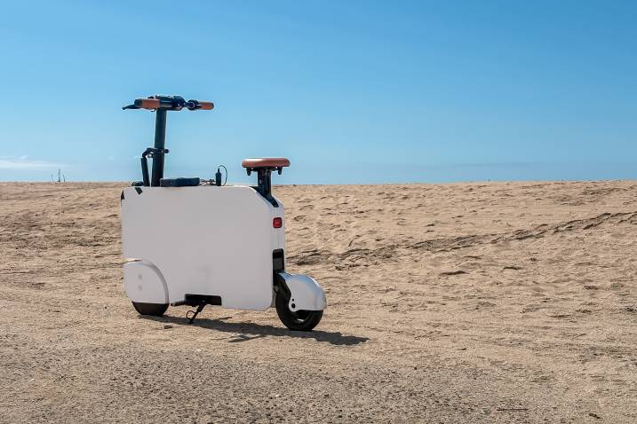 2024 Honda Motocompacto parked outdoors by the beach.