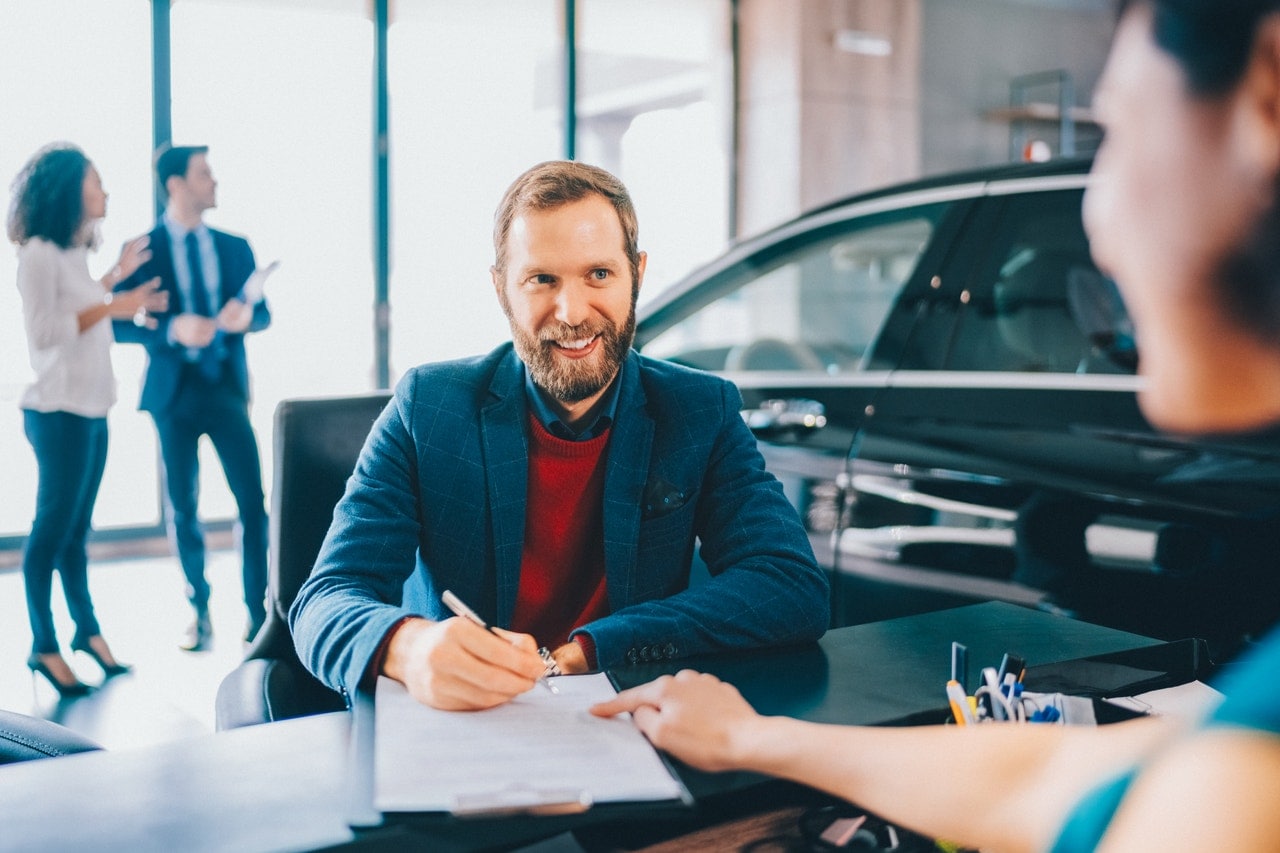 Businessman buying luxury car