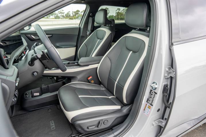 An image of a 2025 Kia EV6 GT-Line while parked on a racetrack.