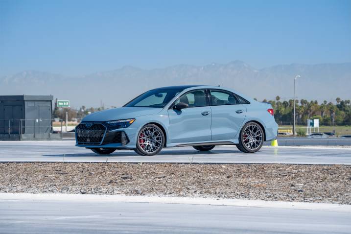 Front three-quarter shot of a 2025 Audi RS 3 parked at a test track.