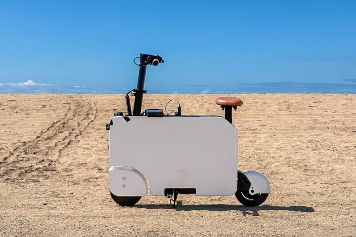 2024 Honda Motocompacto parked outdoors by the beach