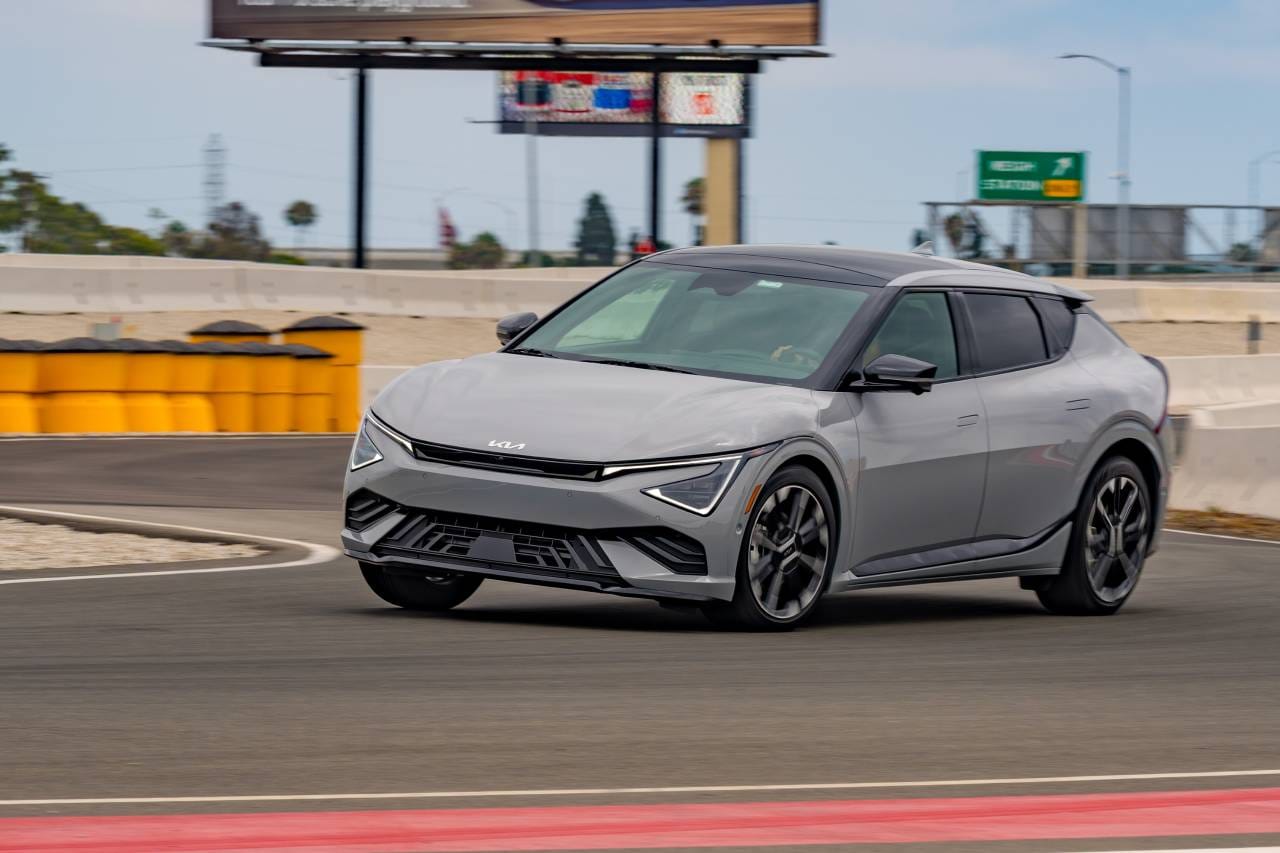 An image of a 2025 Kia EV6 GT-Line driving on a racetrack.