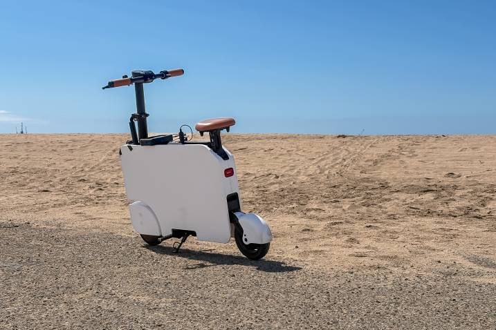 2024 Honda Motocompacto parked outdoors by the beach.