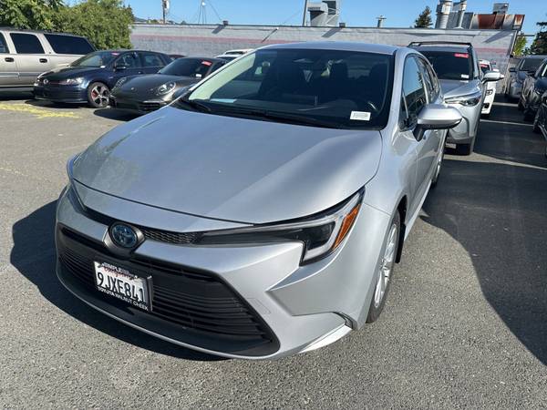 Toyota Corolla Hybrid with VIN: JTDBCMFE9R3034055