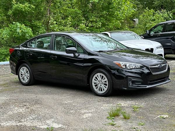 Subaru Impreza with VIN: 4S3GKAD66J3603094