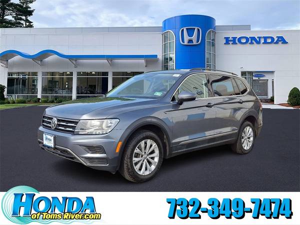 Volkswagen Tiguan with VIN: 3VV3B7AX4JM210077