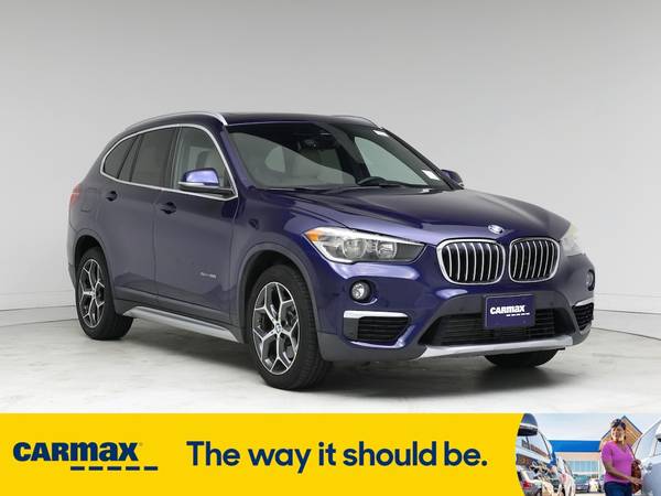 BMW X1 with VIN: WBXHU7C34J5L05479