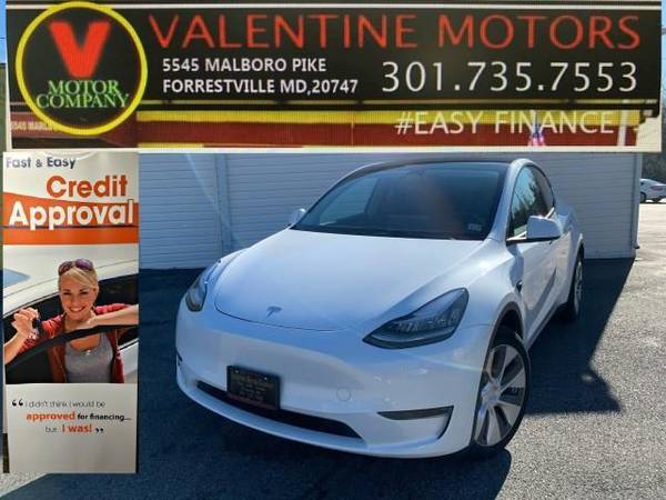 Tesla Model Y with VIN: 7SAYGDEE7PA129004