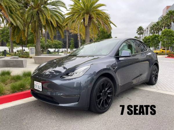 Tesla Model Y with VIN: 7SAYGAEE1PF590491